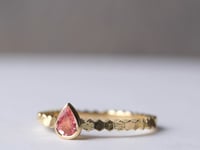 Single hex ring with pear shaped pink spinel