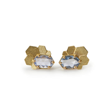 Chaos hex stud earrings with blue oval sapphires